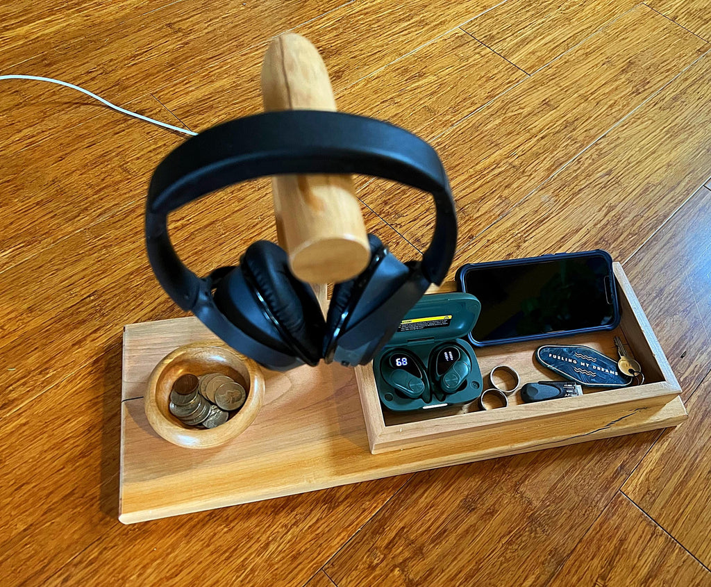 Headphone stand with change holder and cell phone charging station