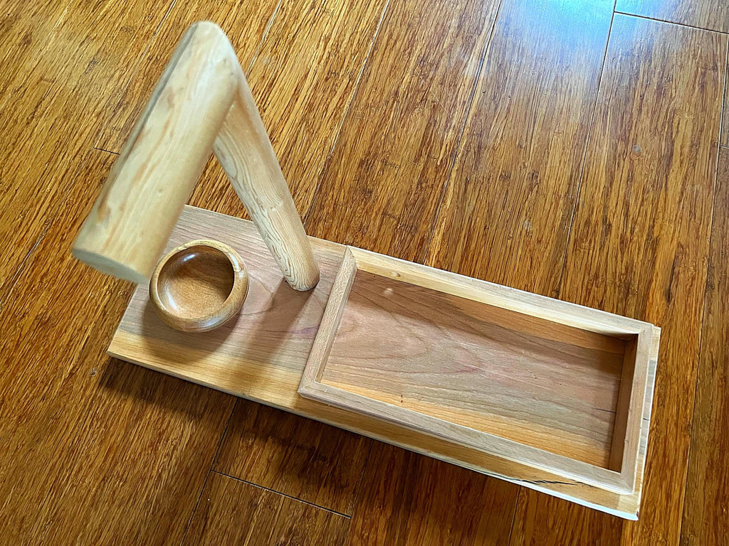 Headphone stand with change holder and cell phone charging station