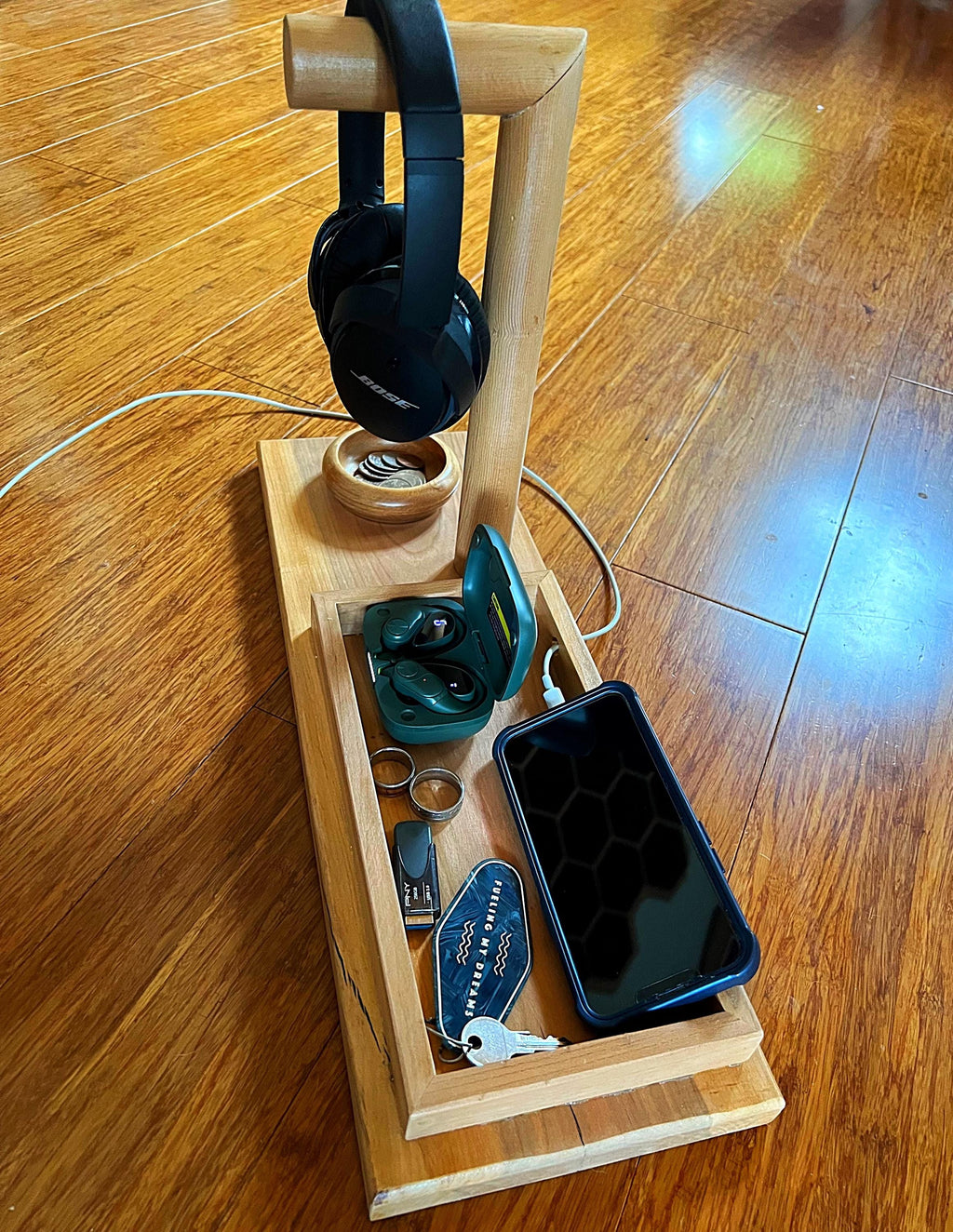 Headphone stand with change holder and cell phone charging station