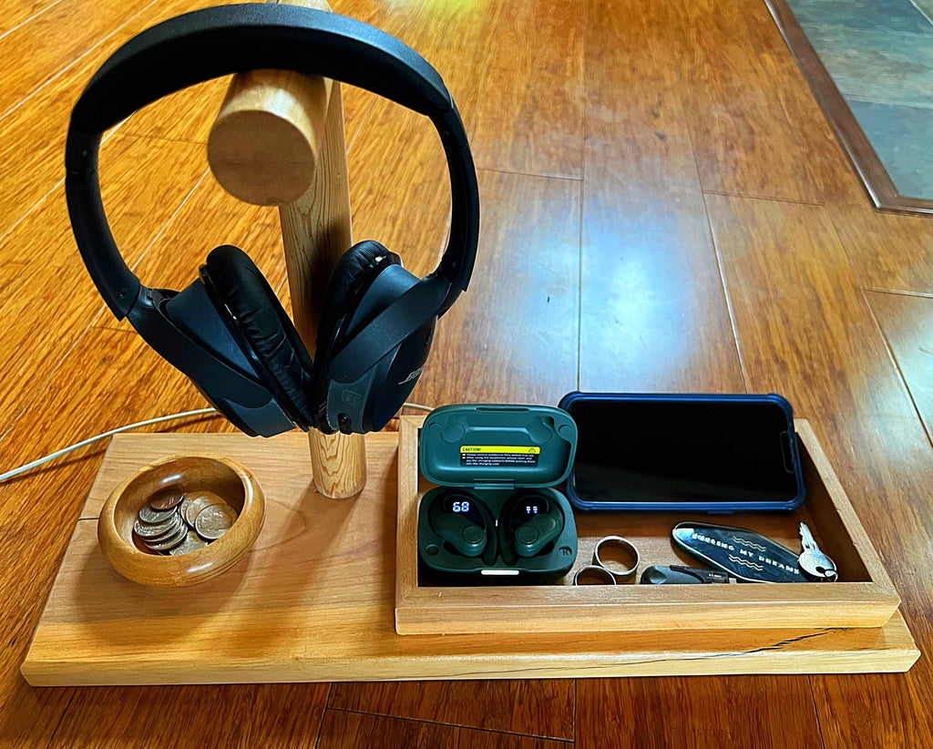 Headphone stand with change holder and cell phone charging station