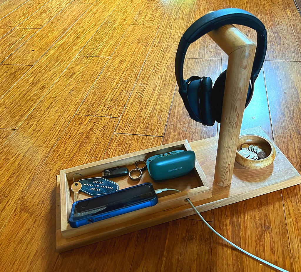 Headphone stand with change holder and cell phone charging station