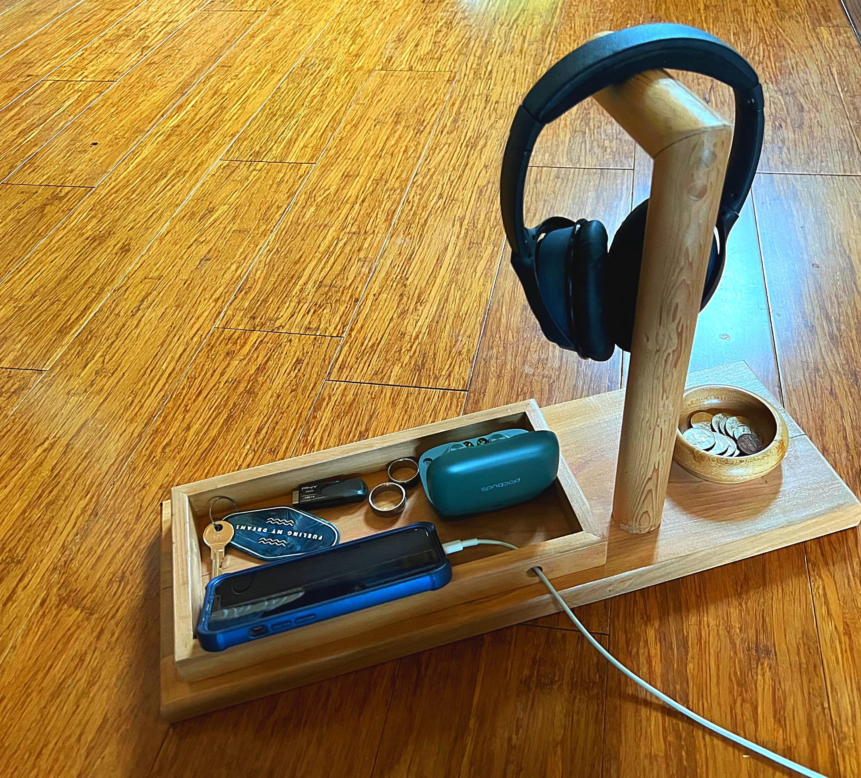 Headphone stand with change holder and cell phone charging station