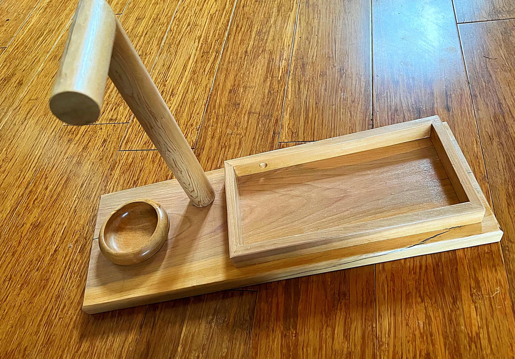 Headphone stand with change holder and cell phone charging station